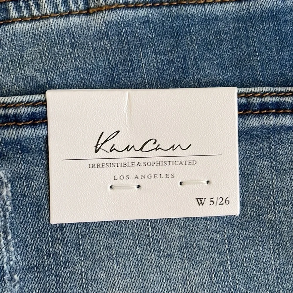Kancan mid rise medium wash distressed five pocket size 5 size 26 jean shorts
